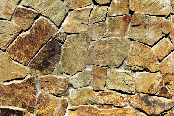 Wall cladding with a crushed stone. Texture.