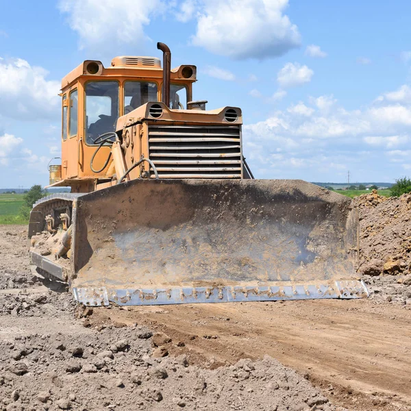 The bulldozer performs excavation work on the pipeline route.