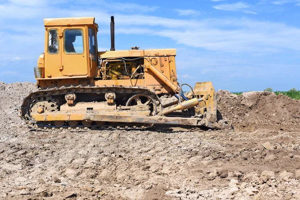The bulldozer performs excavation work on the pipeline route.