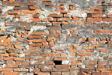 Bir tuğla duvar parçası. Bir tuğla duvar arka plan fotoğraf bir parçası.
