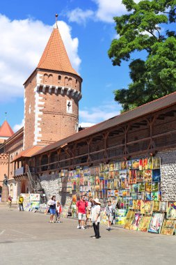 Krakow , Republic of Poland- July 3, 2017: Trade in painting near the fortress wall near St. Florian's Gate.
