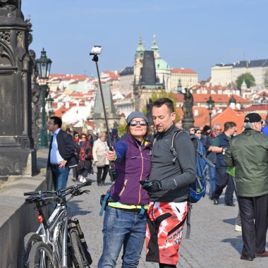 PRAGUE, CZECH REPUBLIC  May 5, 2017: Selfies on the Charles Bridge.