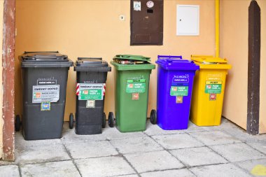 different colors recycling bins in the city 