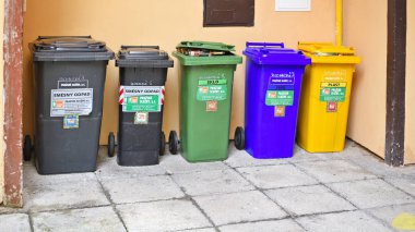 different colors recycling bins in the city 