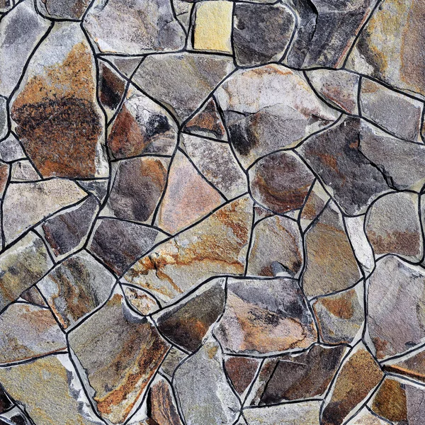 Çatlamış bir taştan bir duvar parçası.