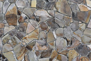 Çatlamış bir taştan bir duvar parçası.