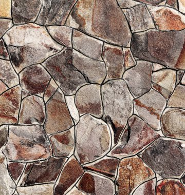 Çatlamış bir taştan bir duvar parçası.