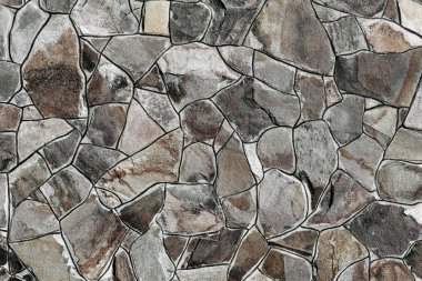 Çatlamış bir taştan bir duvar parçası.