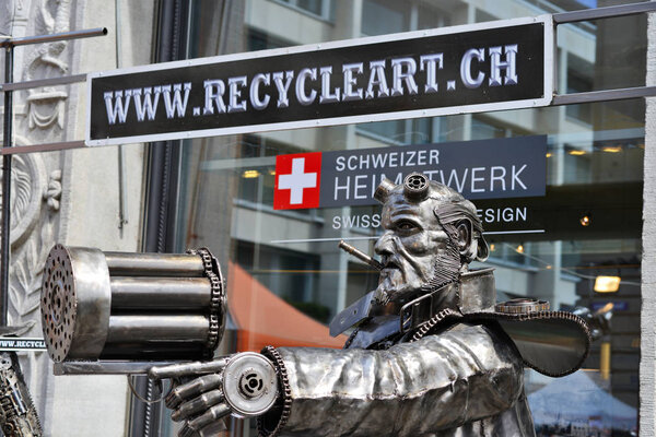 Zurich, Swiss Confederation August 11, 2018: Welded metal sculpture from waste machinery elements at the entrance to the exhibition hall RECYCLEART.CH.