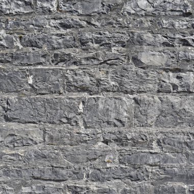 Çatlamış bir taştan bir duvar parçası.