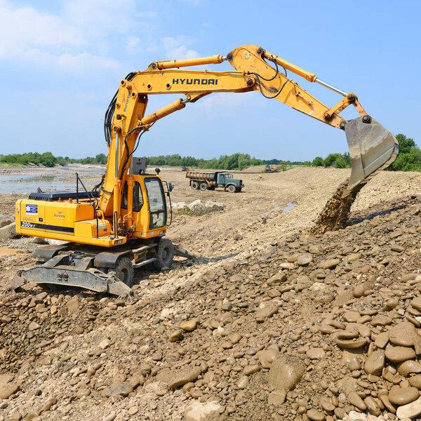 Kalush, Ukraine - July 2, 2015: On the construction of a protective dam near the town of Kalush, Western Ukraine .