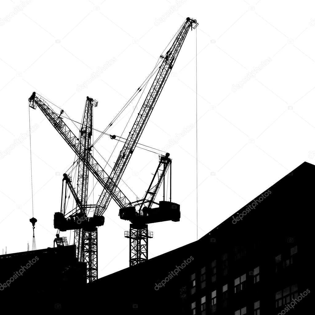 Tower building cranes against the sky.