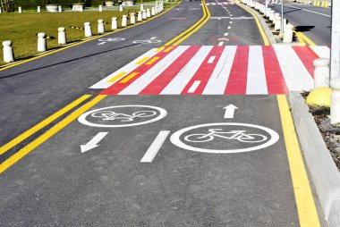 Ukraine, Polyanytsya - October 16, 2018 : Road section with road markings that regulate the movement of pedestrians and cyclists. clipart