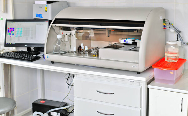 Kalush, Ukraine - April 08, 2019: The AutoLab 100 biochemical and immune enzyme analyzer at the workplace in the clinic.