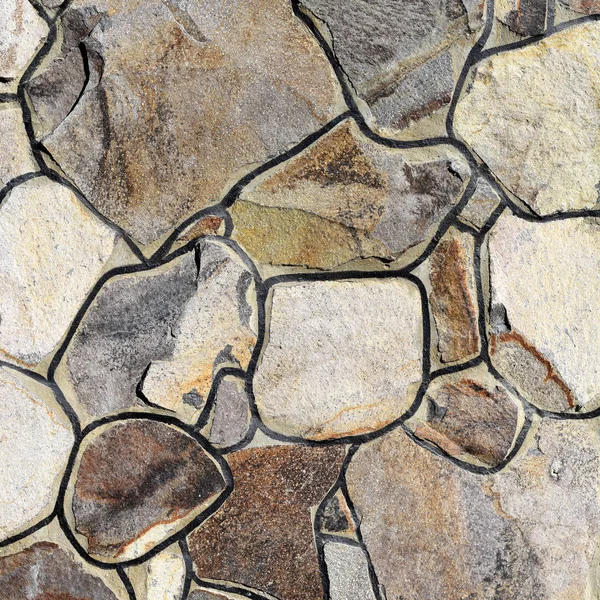 Çatlamış bir taştan bir duvar parçası.
