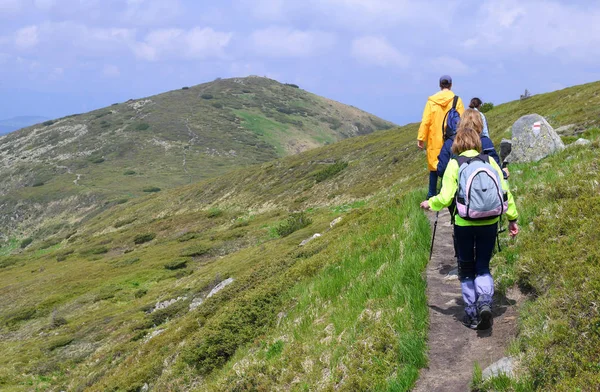 stock image group of tourists hiking in the mountains