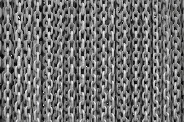 Arkaplan fotoğrafında kaynaklı metal zincirler.