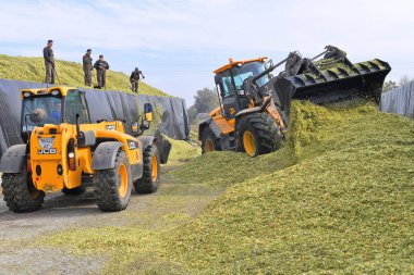 agricultural machinery working at rural field
