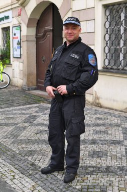 PRAGUE, CZECH REPUBLIC - May 25, 2019: Employee of patrol of the municipal police on the town square of Prague. 