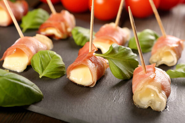 Traditional italian prosciutto ham baked with mozarella cheese