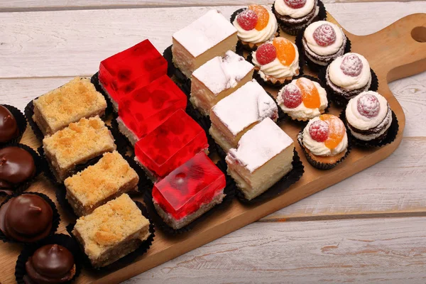 Catering sweets, closeup of various kinds of cakes on event or wedding receptio
