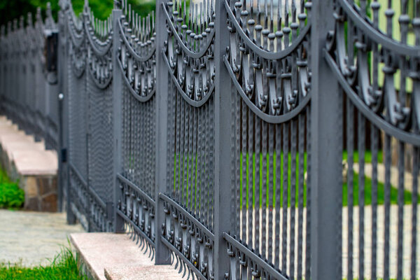 wrought-iron gates, ornamental forging, forged elements close-up.