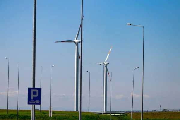 group of windmills for renewable electric energy production.