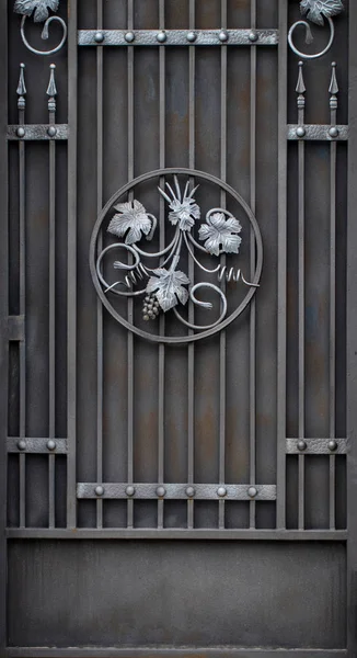 door decoration with ornate wrought-iron elements, close up.