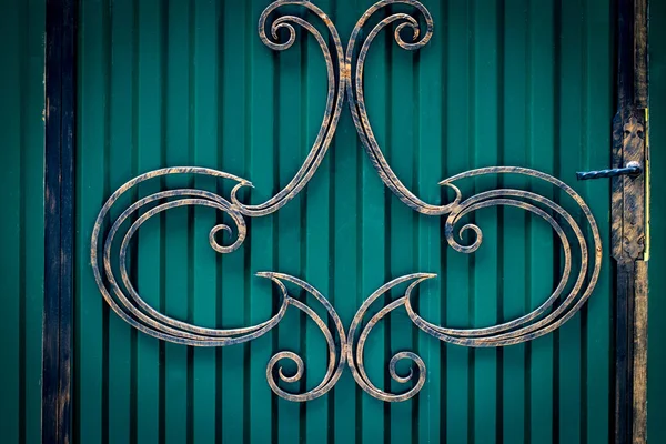 wrought-iron gates, ornamental forging, forged elements close-up.