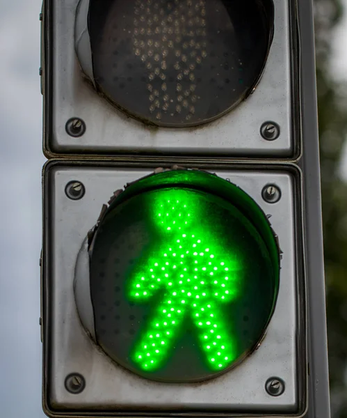 Traffic lights with the green light lit.