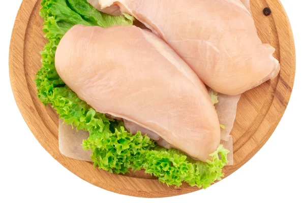 Raw chicken breast fillets on wooden cutting board isolated on — Stock Photo, Image