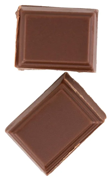 Morceaux de chocolat au lait isolés sur fond blanc — Photo