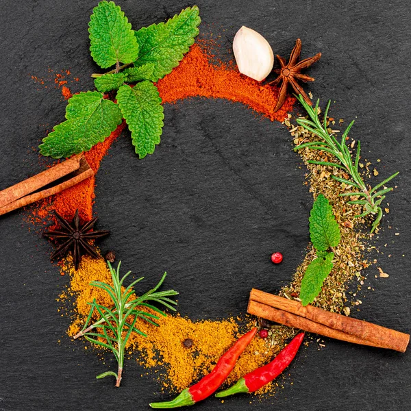 Colourful various herbs and spices on dark background. Top view — ストック写真