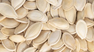 Kabak çekirdeği arka planı. Kabak tohumlarının makro arkaplan dokusu.