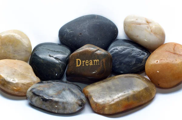 Uma Pedra Rio Polida Marrom Com Palavra Sonho Cercada Por — Fotografia de Stock