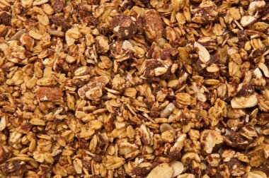 Home made, tamamen doğal, organik granola çikolata ile bakıyordu. Mısır gevreğini görüntünün tamamının doldurur.