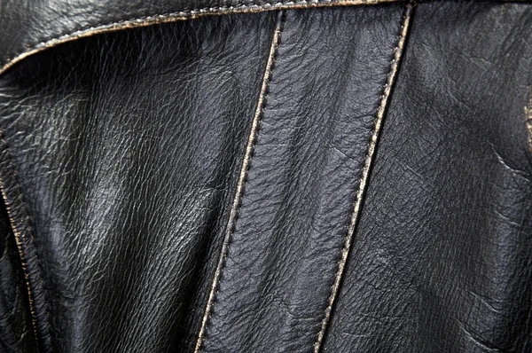 古い革オートバイのジャケットの縫い目に焦点を当てとステッチの詳細します — ストック写真
