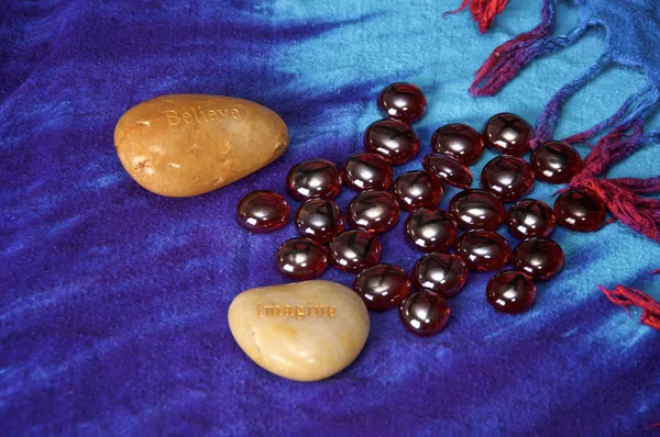 Two Large Rocks Words Believe Imagine Blue Cloth Background Blood — Stock Photo, Image