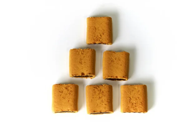 六个无花果棒饼干在白色表面上从上面形成金字塔 计数概念 图库图片