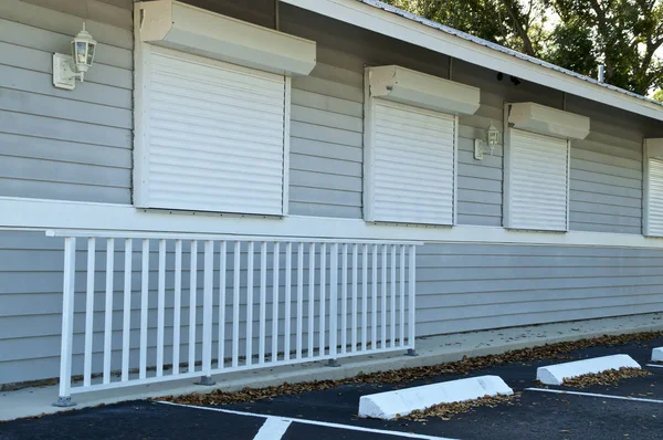 Generic florida building with hurricane shutters — Stock Photo, Image