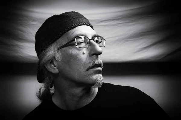 Black and white portrait of man with glasses and beard Stock Picture