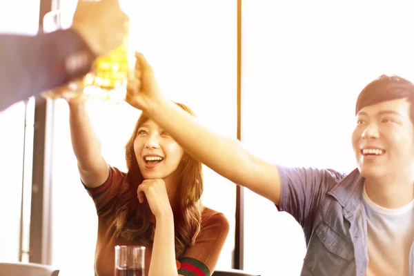 Happy Young Friends Drinking Beer Restaurant — Stock Photo, Image