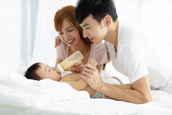 Happy Father Mother Feeding Baby Bottle — Stock Photo, Image