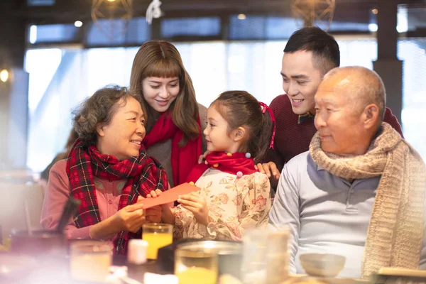 Happy asian family having dinner and celebrating chinese new year — Stock Photo, Image