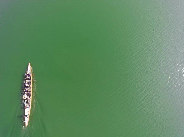 Aerial view of rowing team on water
