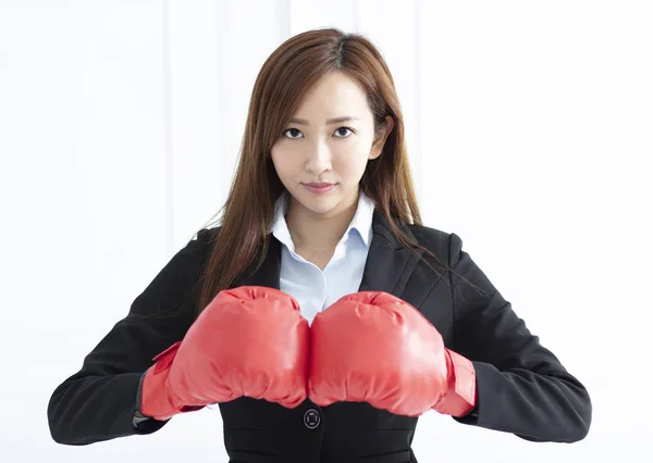 Young Business woman wearing boxing gloves ready to fight — Stock Photo, Image