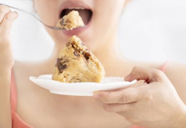 woman mouth eating traditional  rice dumplings  