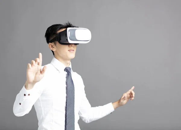 Portrait of young businessman in vr goggles — Stock Photo, Image