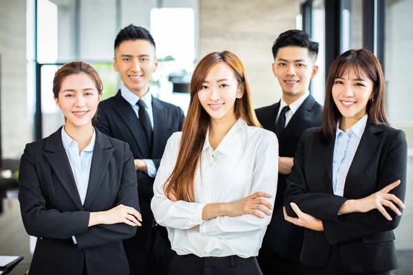 Confident asian business team stands in office — Stock Photo, Image