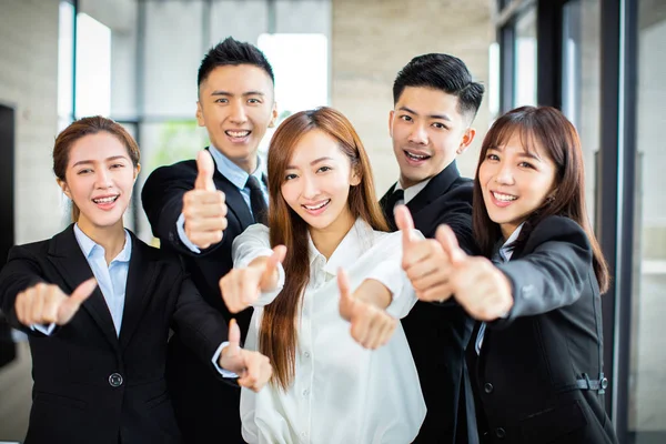 Confident asian business team showing thumbs up — Stock Photo, Image